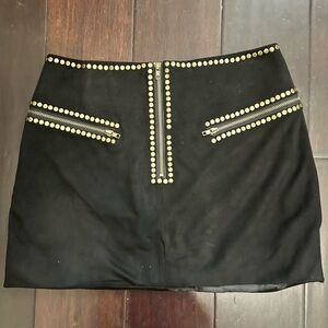 Black, gold studded mini skirt